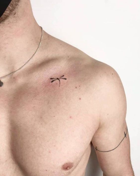 Minimalist tattoos 2024: Bold designs for men 15 ideas