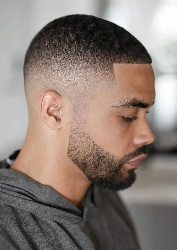 Mastering the buzz cut: bold 2024 styles for dark-skinned men 16 ideas