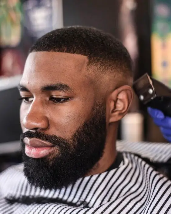 Mastering the buzz cut: bold 2024 styles for dark-skinned men 16 ideas